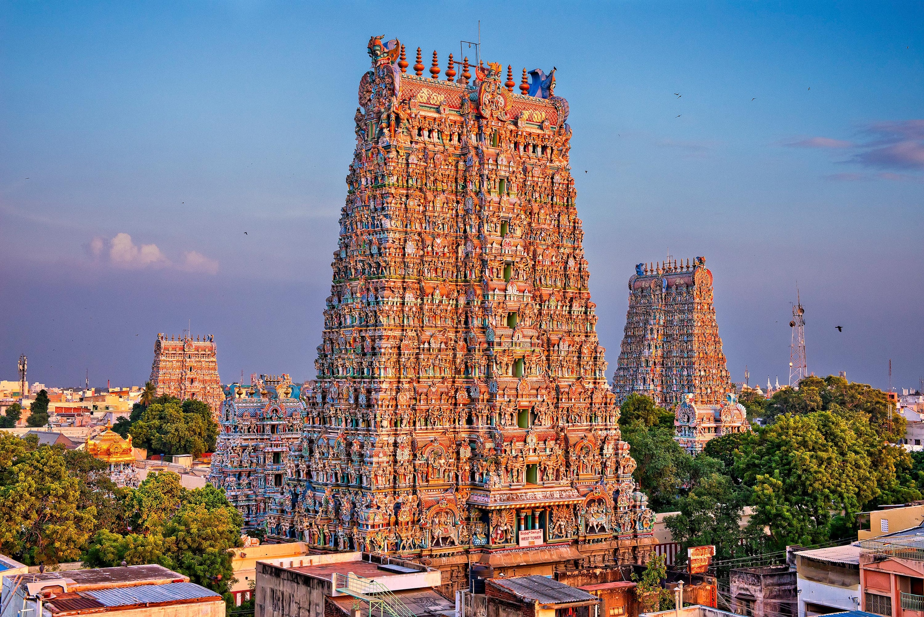 Majestic Meenakshi Amman Temple gopurams against a twilight sky